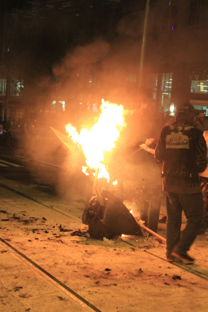 Pressurized containers of some sort kept exploding in the fire, and people began to move back